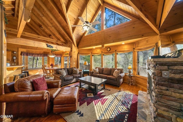 living room featuring ceiling fan, high vaulted ceiling, plenty of natural light, and hardwood / wood-style flooring