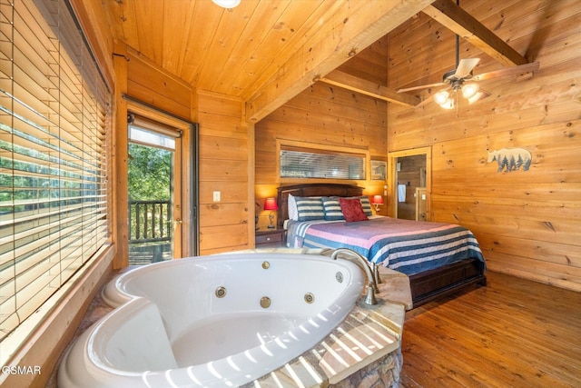 bedroom featuring wood ceiling, hardwood / wood-style flooring, wooden walls, access to outside, and vaulted ceiling