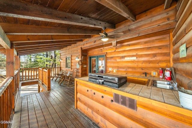 wooden deck featuring ceiling fan and a grill