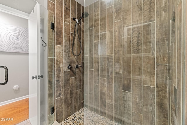 bathroom with tile patterned floors and walk in shower