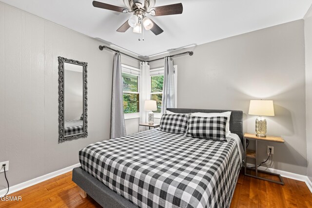 bedroom featuring hardwood / wood-style floors and ceiling fan