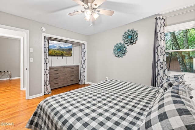 bedroom featuring light hardwood / wood-style flooring and ceiling fan