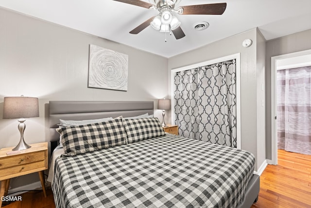 bedroom featuring hardwood / wood-style flooring and ceiling fan