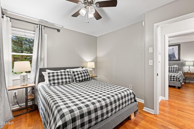 bedroom featuring ceiling fan and light hardwood / wood-style floors