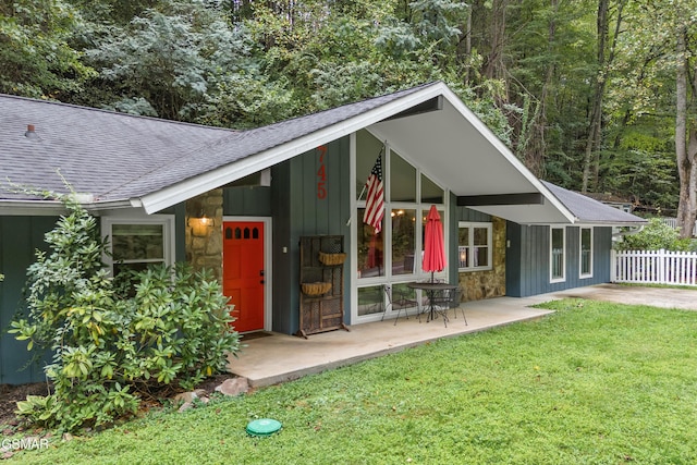 view of outbuilding featuring a lawn