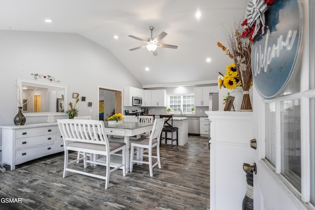 dining area featuring ceiling fan, high vaulted ceiling, dark wood-style flooring, and recessed lighting