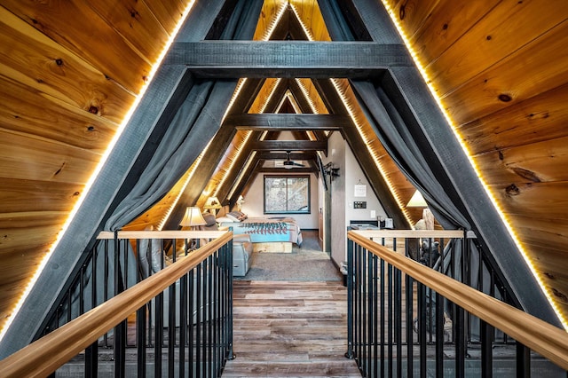 bonus room featuring wood ceiling, lofted ceiling with beams, and hardwood / wood-style floors