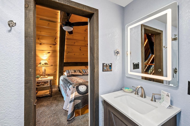 bathroom featuring vanity and ceiling fan