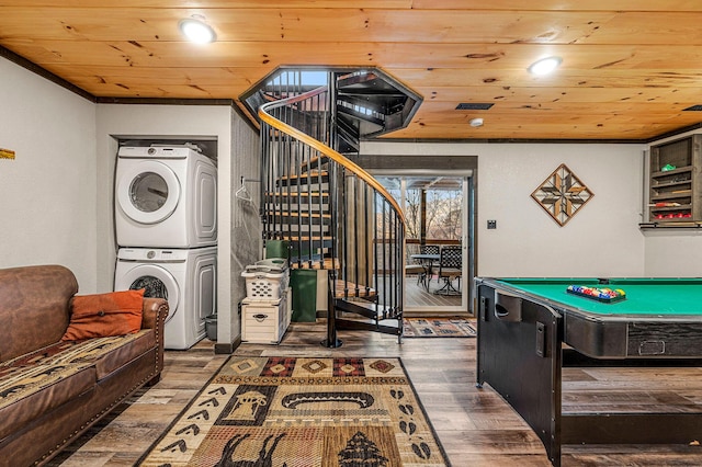 recreation room featuring stacked washer / dryer, dark wood-type flooring, pool table, and wooden ceiling