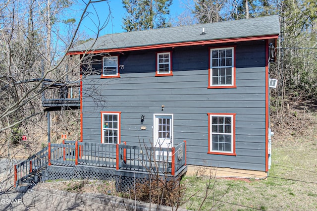 662 Morning Mist Way, Gatlinburg, TN 37738 - rear view of house featuring a lawn, a shingled roof, and a wooden deck