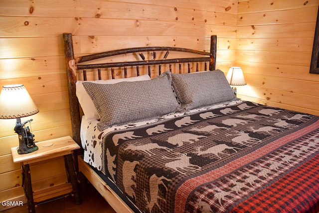 bedroom featuring wood walls
