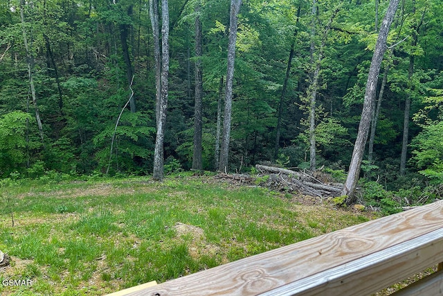 view of yard with a view of trees