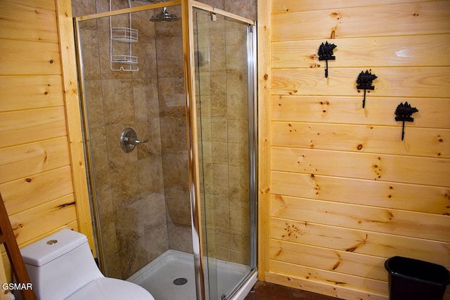full bath with a shower stall and toilet