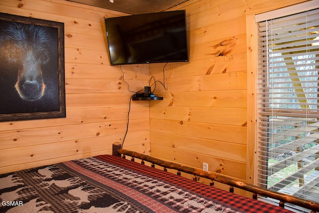bedroom with wood walls