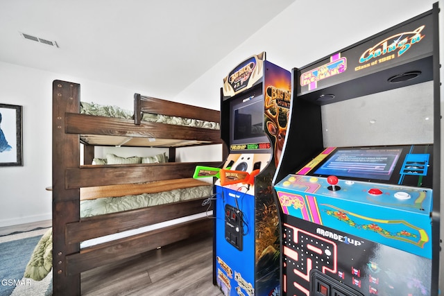 rec room featuring wood finished floors and visible vents