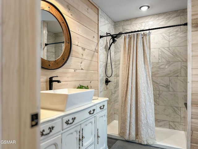full bathroom with a shower stall and vanity