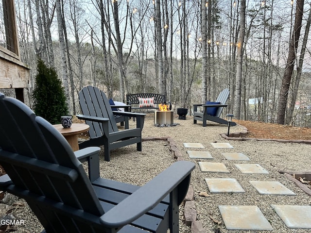 view of patio / terrace with an outdoor fire pit