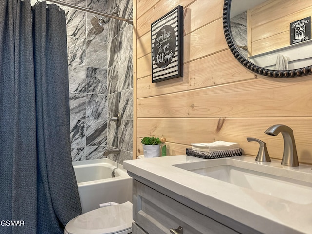 bathroom with shower / bath combo, toilet, and vanity