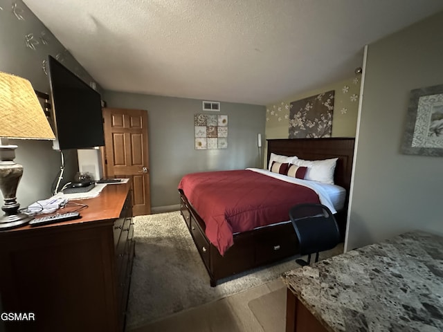 bedroom featuring a textured ceiling