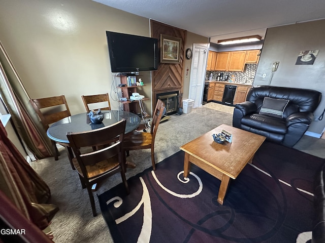 living room featuring carpet flooring and a fireplace