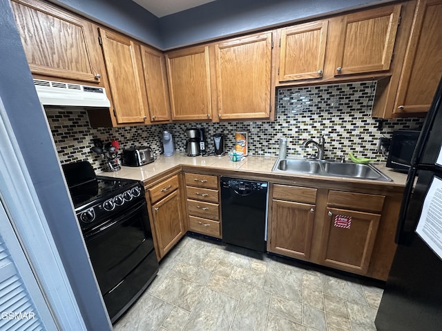 kitchen with sink, backsplash, and black appliances