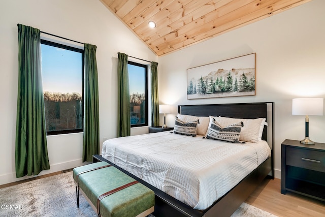 bedroom featuring wooden ceiling, multiple windows, wood finished floors, and lofted ceiling