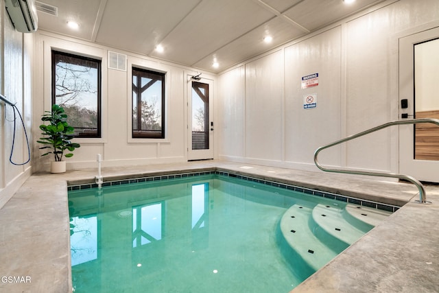 indoor pool with a wall mounted air conditioner