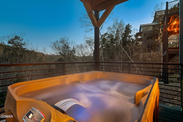 exterior space with a hot tub