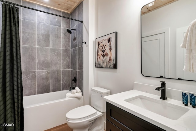 full bath featuring vanity, toilet, and shower / tub combo