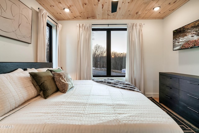 bedroom featuring wood ceiling, multiple windows, recessed lighting, and access to outside