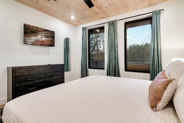 bedroom with wooden ceiling and recessed lighting