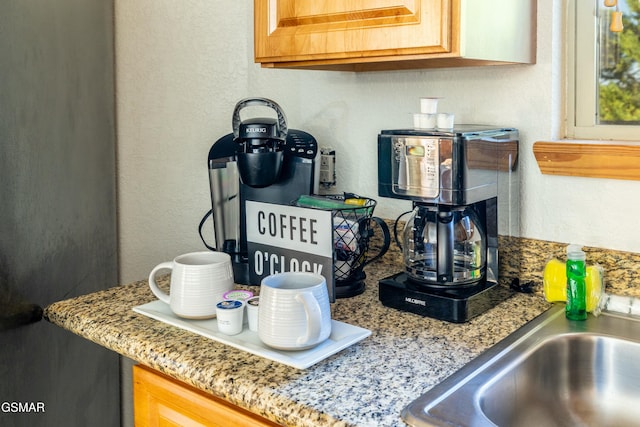 details featuring light stone countertops