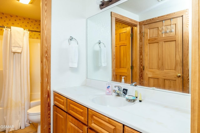 full bathroom featuring tile patterned floors, shower / tub combo with curtain, vanity, and toilet