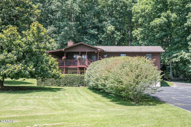 3188 Wears Dr, Sevierville, TN 37862 - view of front of home featuring a chimney, driveway, and a front yard