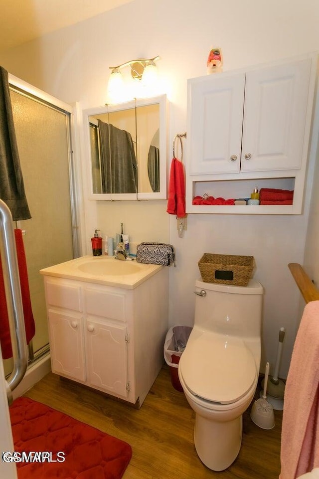 3188 Wears Dr, Sevierville, TN 37862 - bathroom with toilet, a shower stall, and wood finished floors