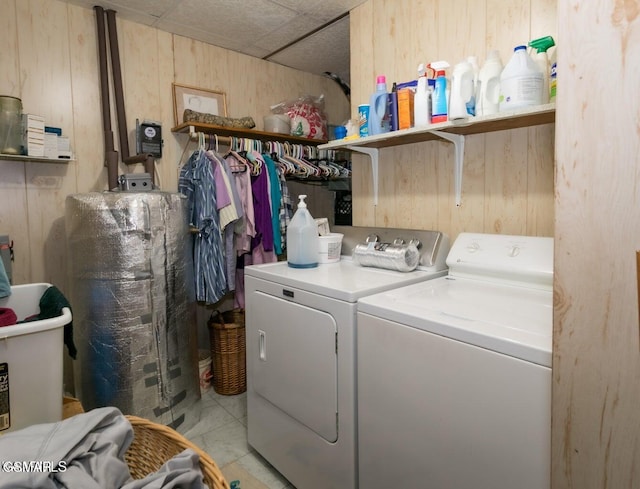 3188 Wears Dr, Sevierville, TN 37862 - clothes washing area with wooden walls, separate washer and dryer, laundry area, and marble finish floor