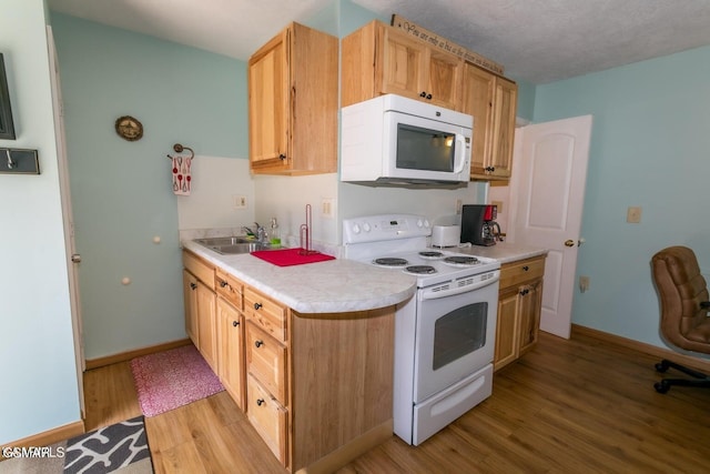 3188 Wears Dr, Sevierville, TN 37862 - kitchen featuring a sink, baseboards, light wood finished floors, and white appliances