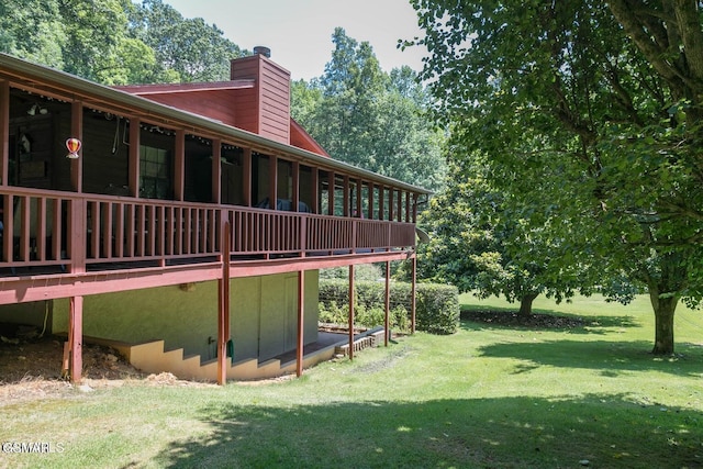 3188 Wears Dr, Sevierville, TN 37862 - view of home's exterior featuring a yard, a chimney, and a deck