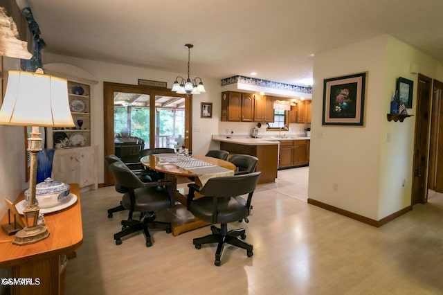 3188 Wears Dr, Sevierville, TN 37862 - dining room with an inviting chandelier, plenty of natural light, and light wood-style floors