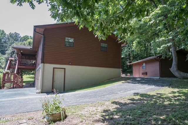 3188 Wears Dr, Sevierville, TN 37862 - view of home's exterior with a wooden deck, stairs, and driveway