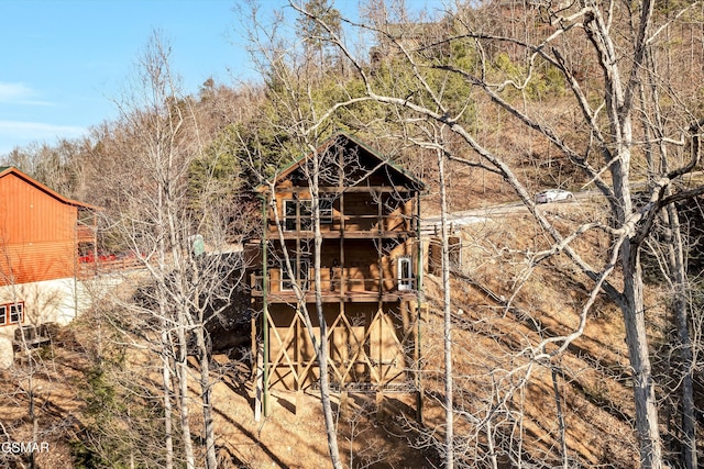 back of property with a wooden deck