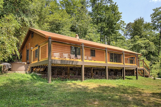 rear view of house with a yard