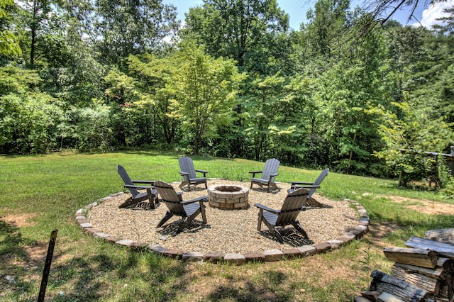 view of yard with a fire pit