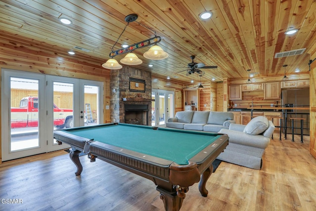 recreation room featuring light wood finished floors, visible vents, french doors, and wood ceiling