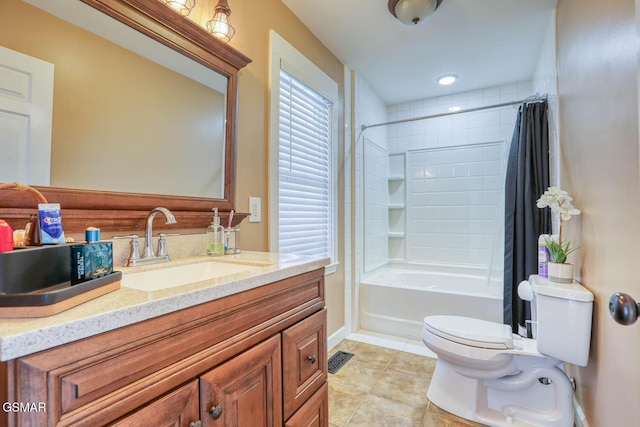 full bathroom featuring vanity, baseboards, shower / bath combo with shower curtain, tile patterned floors, and toilet