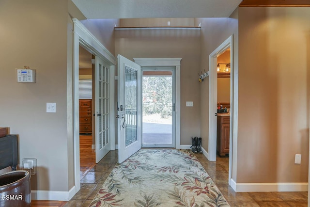 entryway featuring french doors and baseboards