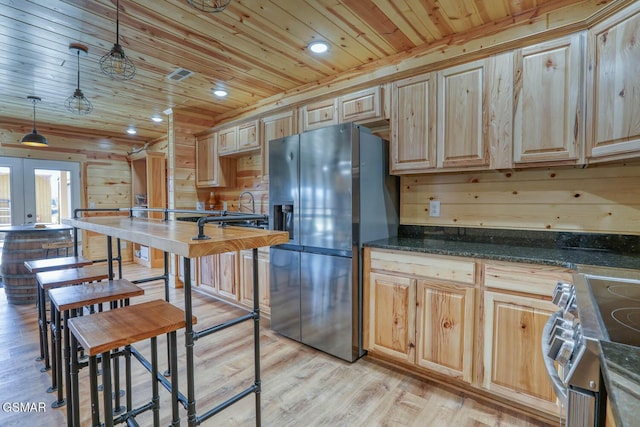 kitchen featuring visible vents, appliances with stainless steel finishes, wooden ceiling, and light wood finished floors