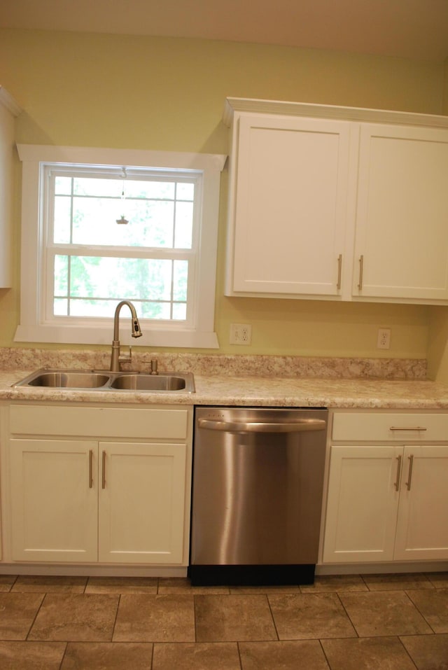 kitchen featuring white cabinetry, sink, and stainless steel dishwasher