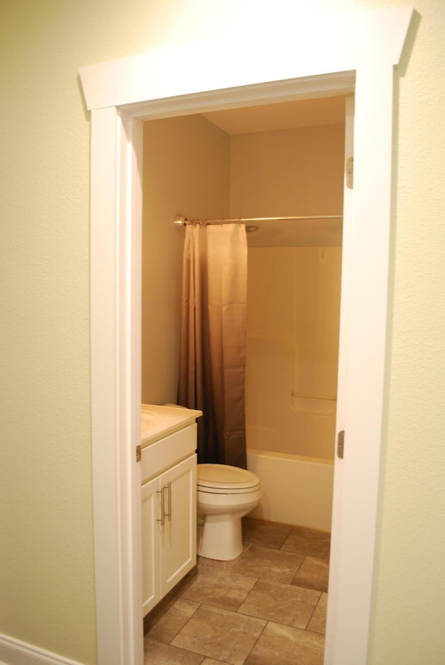 full bathroom with vanity, toilet, and shower / tub combo with curtain