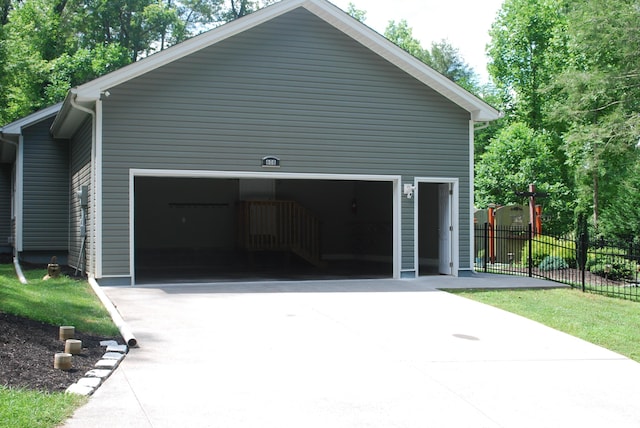 view of side of property with a garage